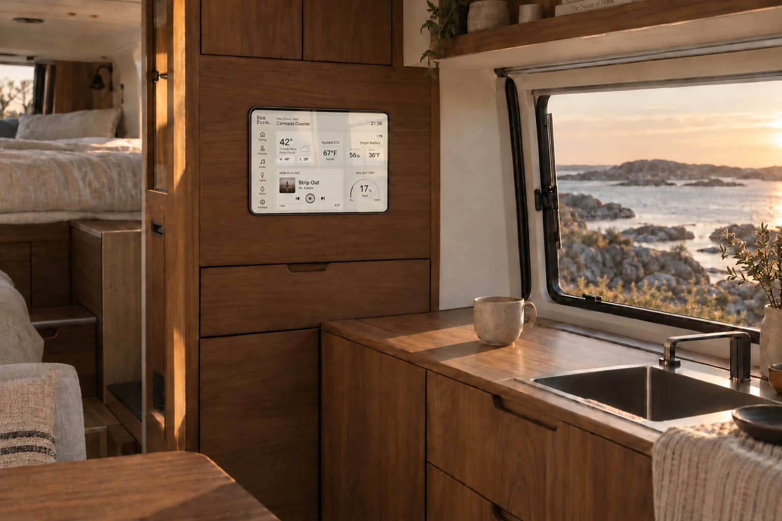 A small landscape tablet integrated into walnut camper cabinetry, displaying the existing Ena Form. interface beside a coastal window.