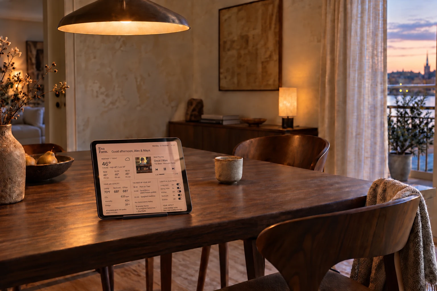 A small iPad mini sized landscape tablet on a discreet stand on a walnut dining table, showing a warm clay Ena Form. dashboard in a softly lit interior.